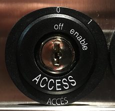 picture of a lock with three signs - off, enable and access