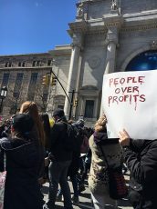 March for our lives protest in New York in 2018 where a protestor's slogan reads: People over Profits