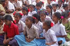 Girl Students wearing their school uniform and sitting in rows in a School in Chhattisgarh