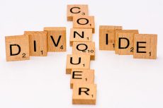 pic of scrabble tiles saying divide and conquer